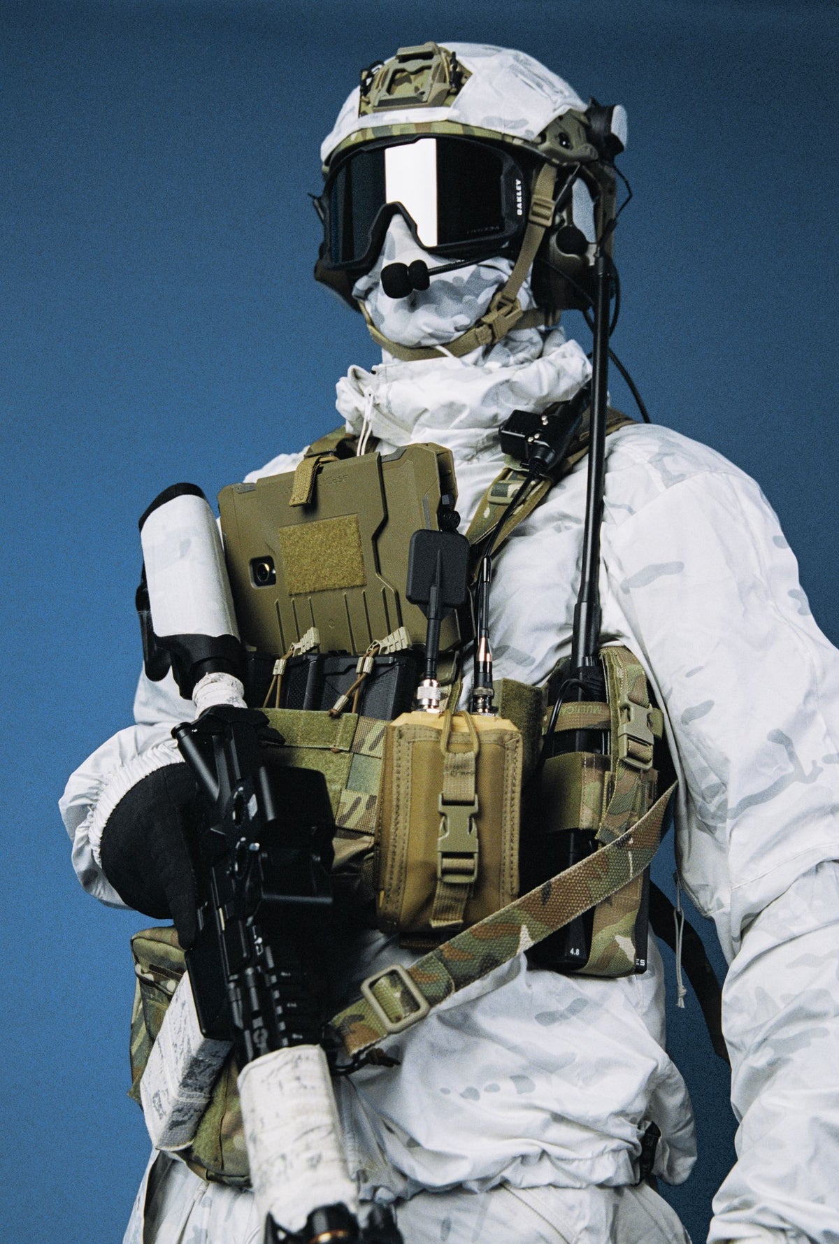 Winter-camouflaged operator wearing MOTH on a chest rig