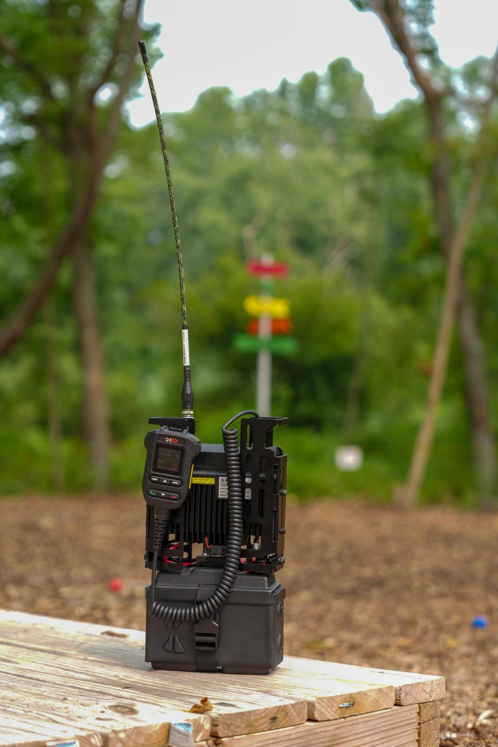 UV-PRO MANPACK standing in the field with the antenna at full height